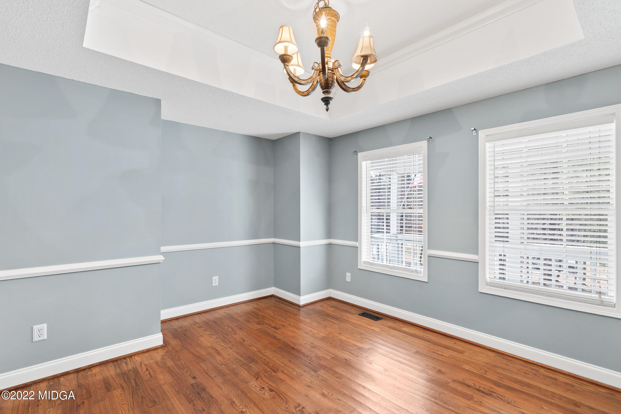 245 Lite-N-Tie Road Gray, GA 31032 - Photo 9 of 29 a view of an empty room with wooden floor and a window