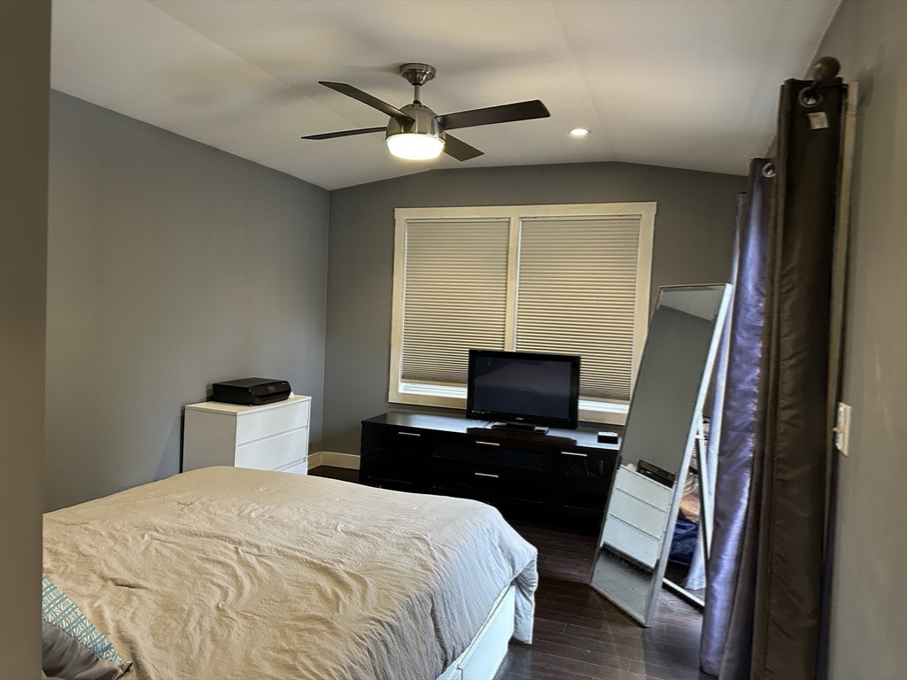 153 Freeman Street Haverhill, MA 01832 - Photo 21 of 31 a bedroom with a bed and a flat tv screen on a dresser