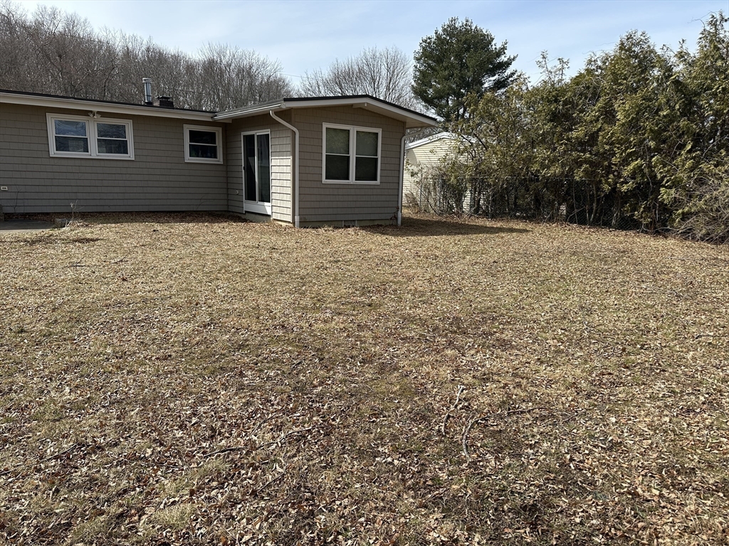 153 Freeman Street Haverhill, MA 01832 - Photo 3 of 31 a front view of a house with large trees
