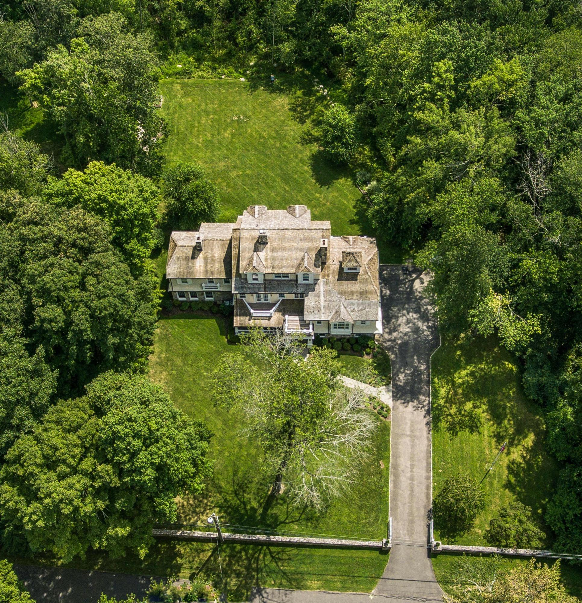 56 Logan Road New Canaan, CT 06840 - Photo 2 of 40 an aerial view of a house with pool outdoor seating and yard
