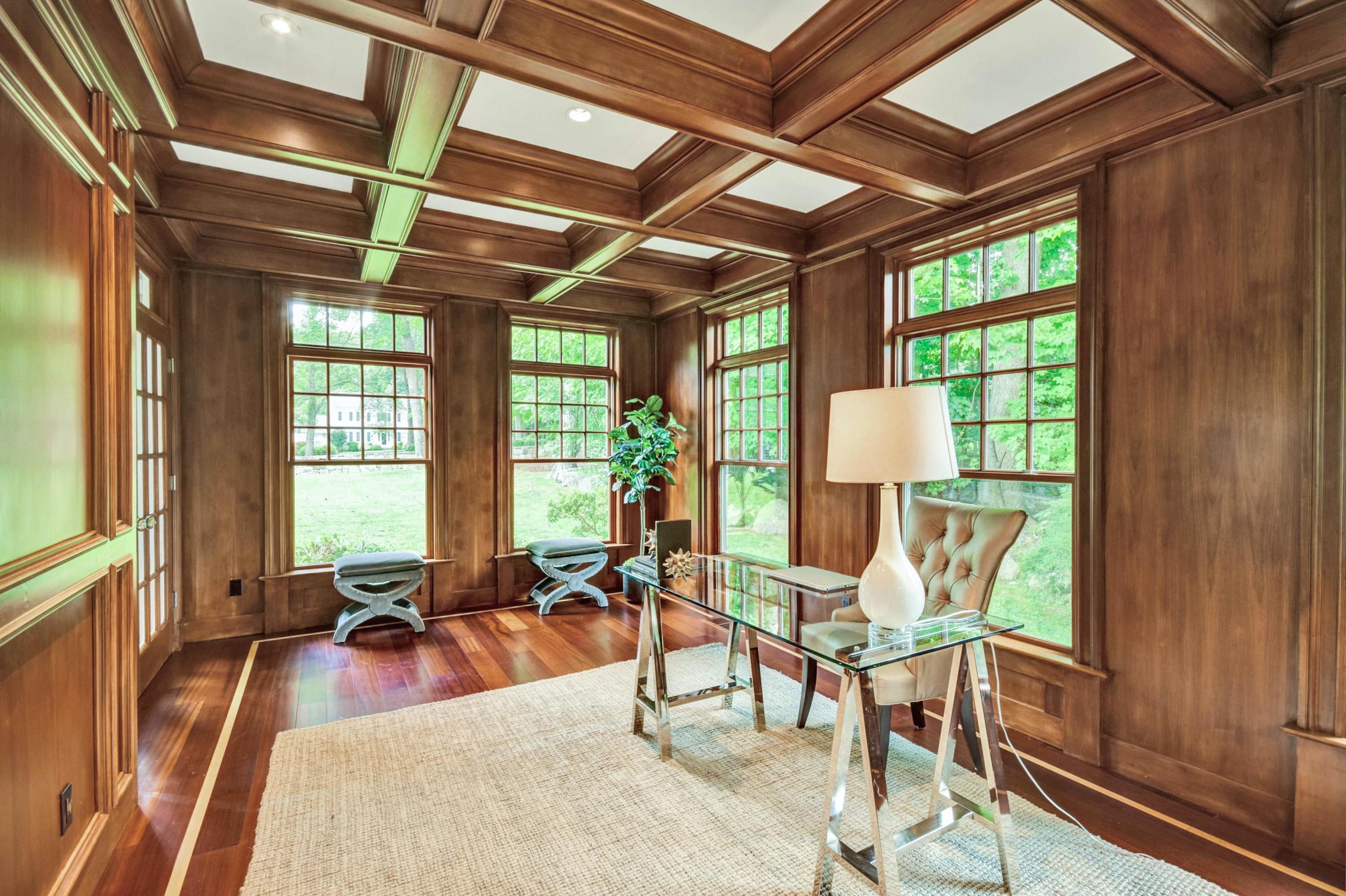 56 Logan Road New Canaan, CT 06840 - Photo 19 of 40 a living room with furniture tv and large windows