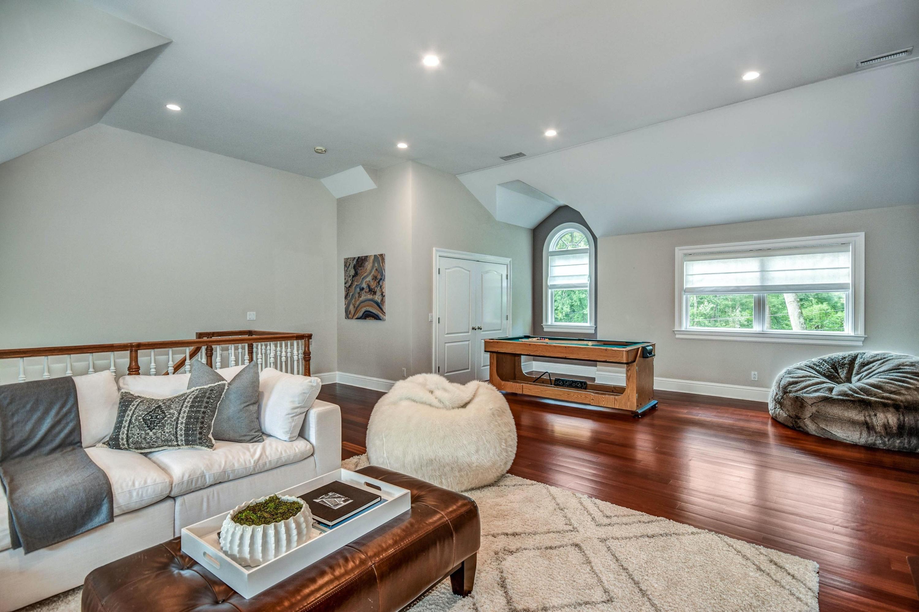 56 Logan Road New Canaan, CT 06840 - Photo 22 of 40 a living room with furniture and a large window