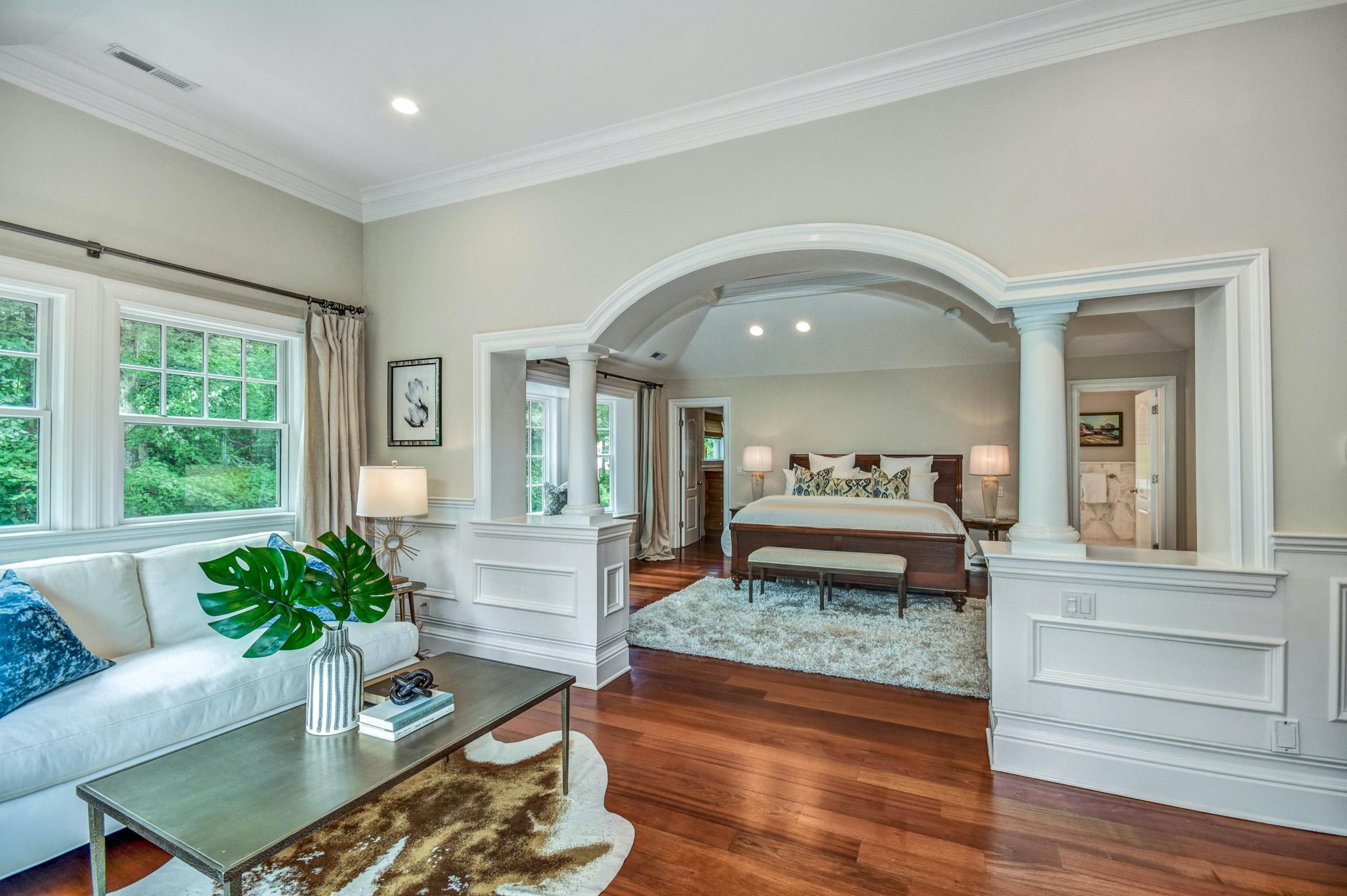 56 Logan Road New Canaan, CT 06840 - Photo 25 of 40 a living room with furniture and a potted plant
