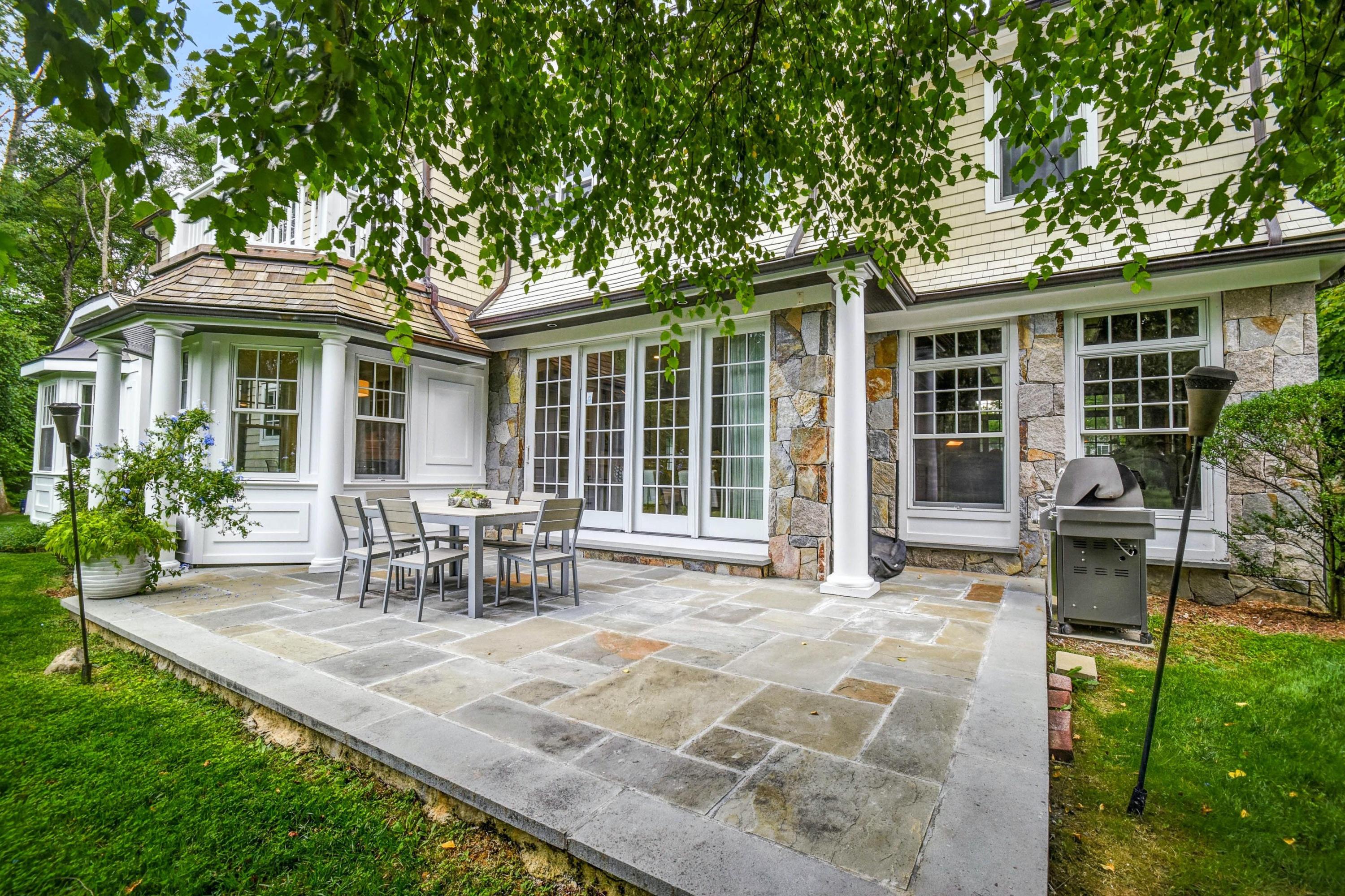 56 Logan Road New Canaan, CT 06840 - Photo 33 of 40 a view of a house with backyard sitting area and garden
