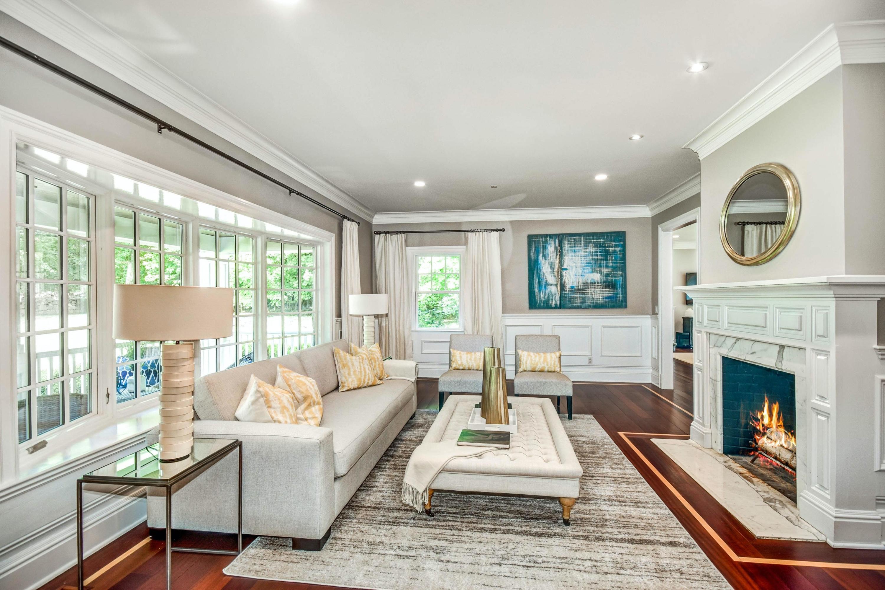 56 Logan Road New Canaan, CT 06840 - Photo 8 of 40 a living room with furniture and a fireplace