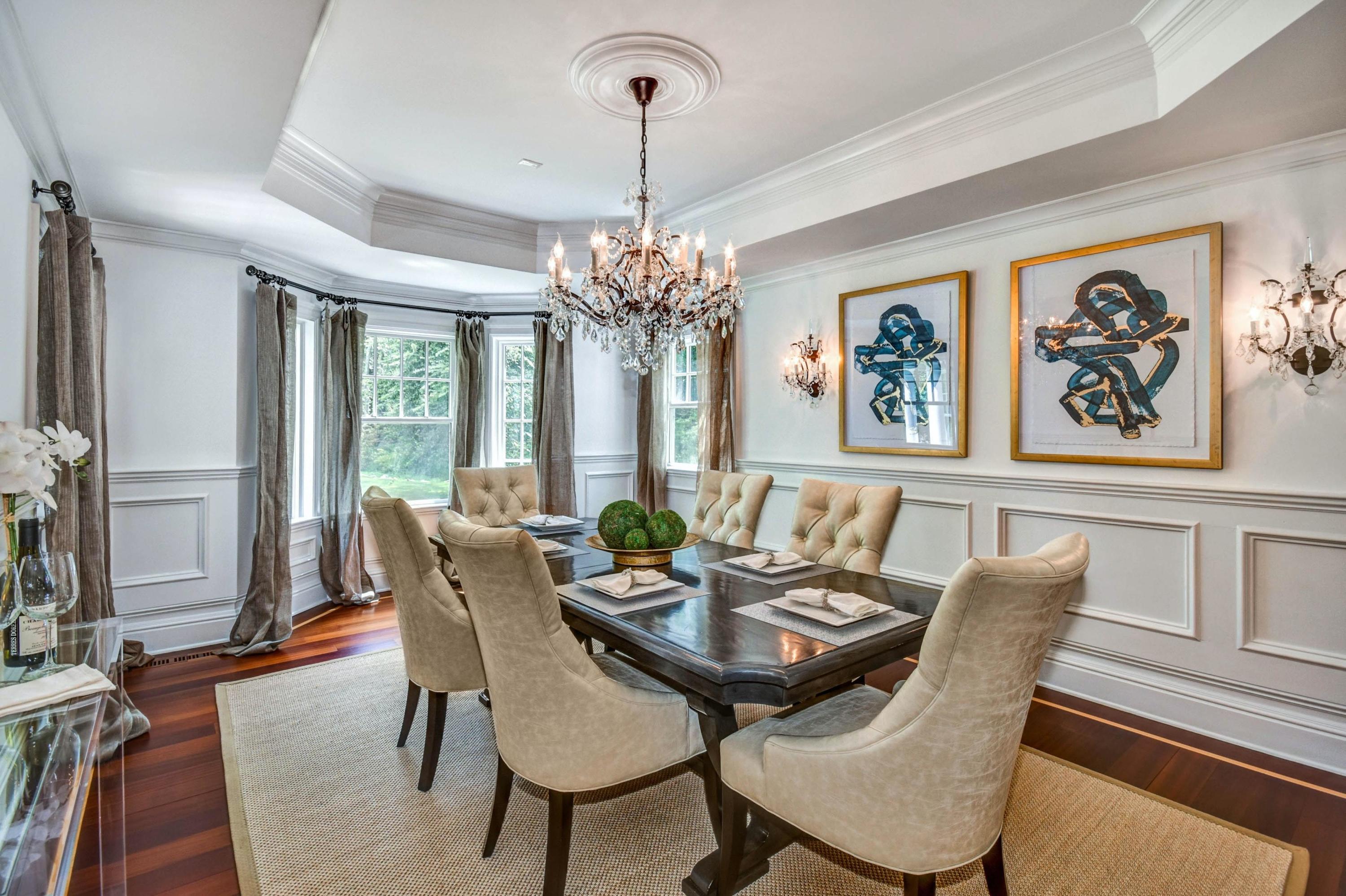56 Logan Road New Canaan, CT 06840 - Photo 9 of 40 a dining room with furniture a chandelier and wooden floor
