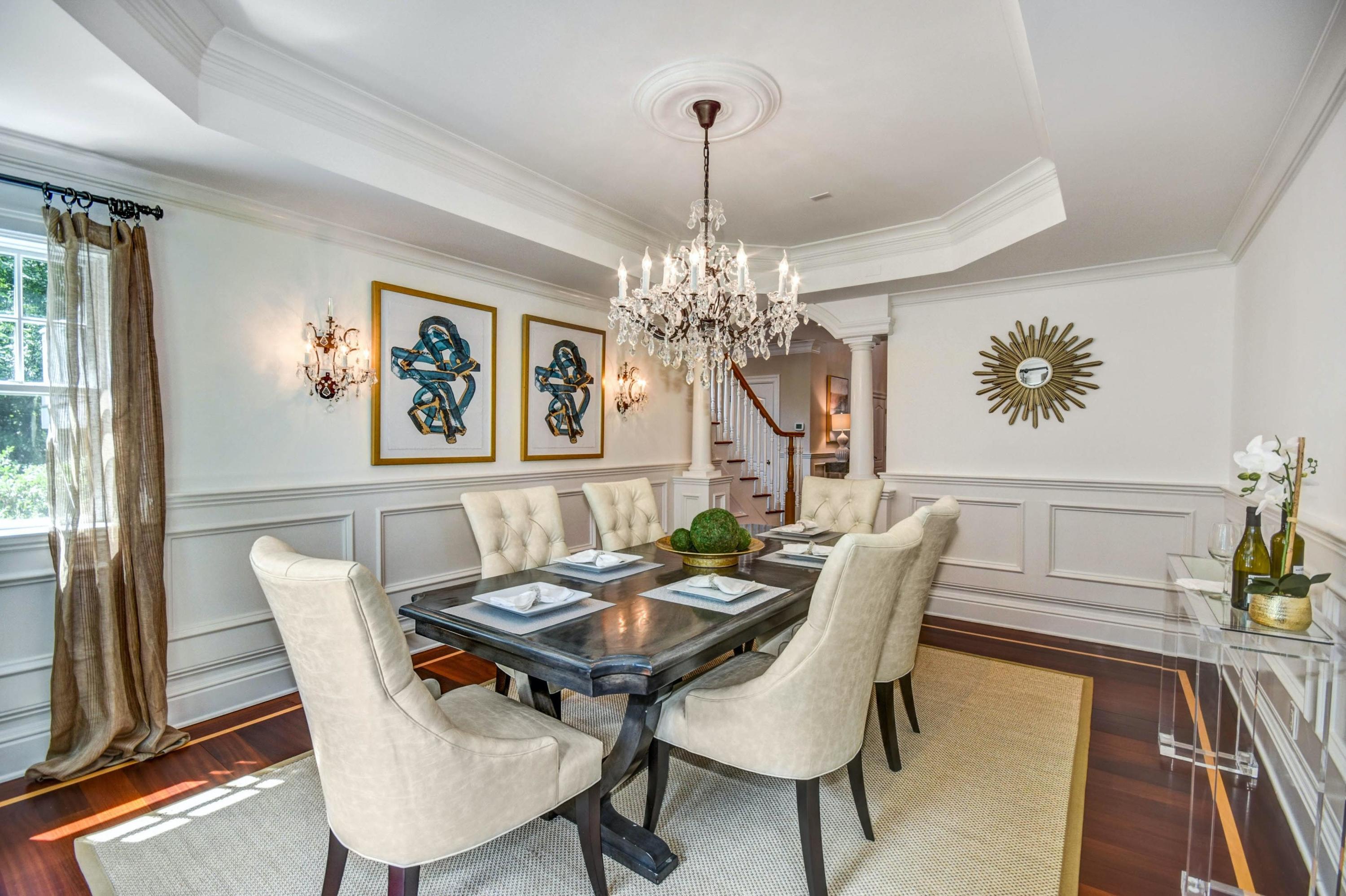 56 Logan Road New Canaan, CT 06840 - Photo 10 of 40 a view of a dining room with furniture a chandelier and wooden floor