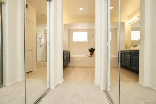 a view of a bathroom with a tub and shower