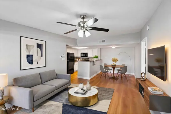 a living room with furniture and a flat screen tv