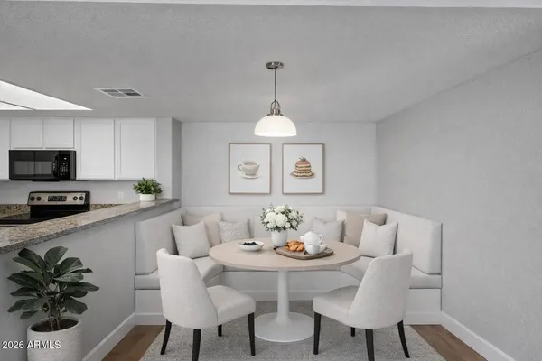 a kitchen with stainless steel appliances granite countertop a sink and a granite counter tops
