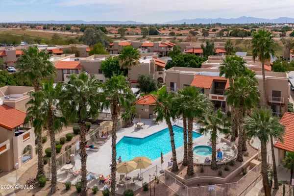 a view of multiple houses with a street