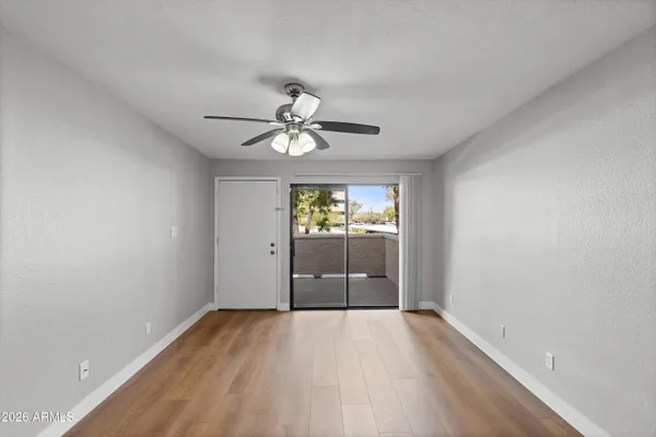 wooden floor in an empty room with a window