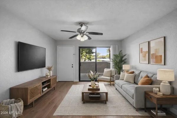 a living room with furniture and a flat screen tv