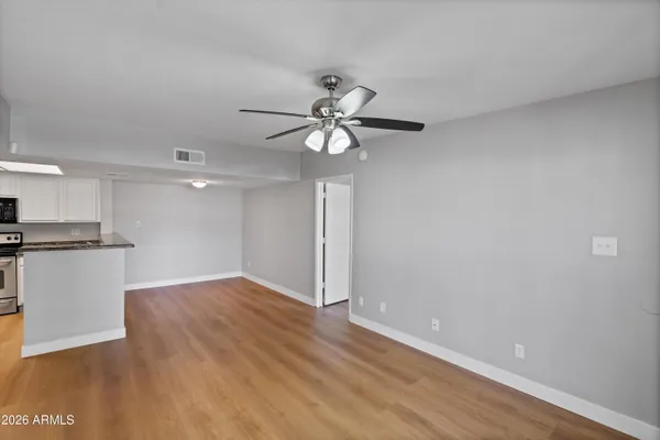 a kitchen with stainless steel appliances a refrigerator sink and microwave