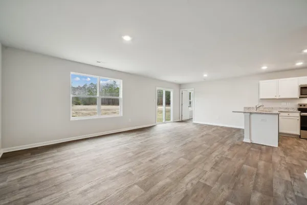 a view of kitchen with wooden floor