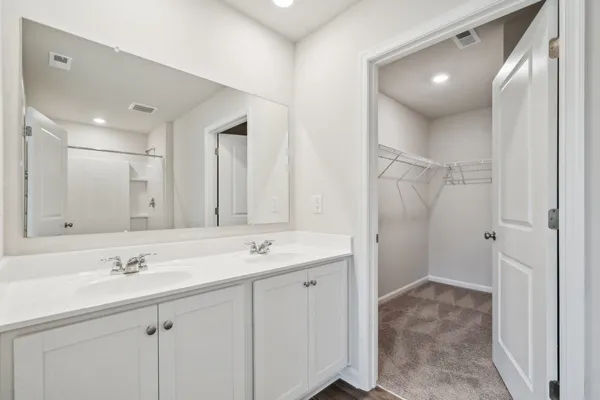 a bathroom with a toilet tub and shower