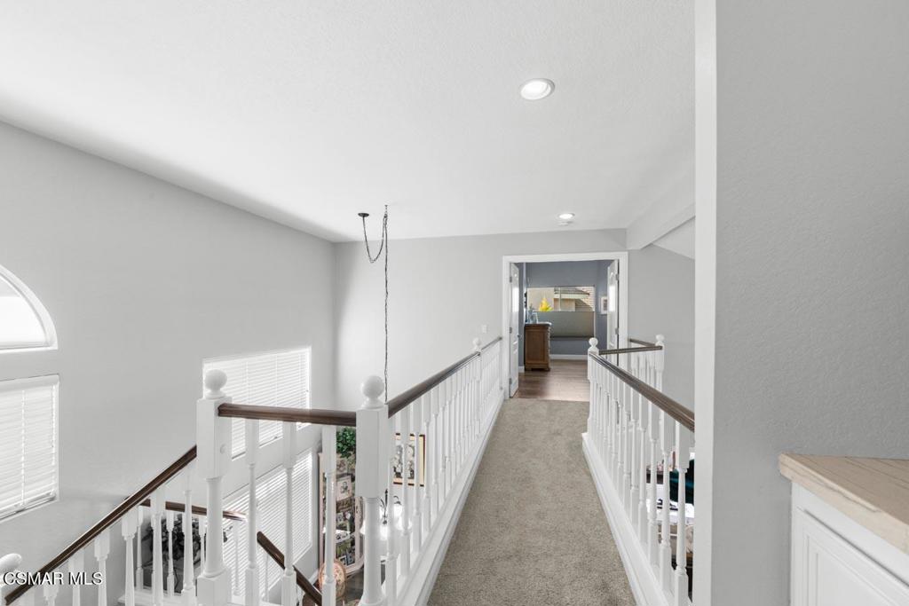 582 Fairfield Road Simi Valley, CA 93065 - Photo 13 of 31 a view of a hallway with wooden floor and entryway