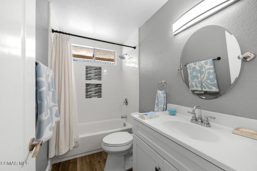 582 Fairfield Road Simi Valley, CA 93065 - Photo 15 of 31 a bathroom with a granite countertop sink mirror vanity and toilet