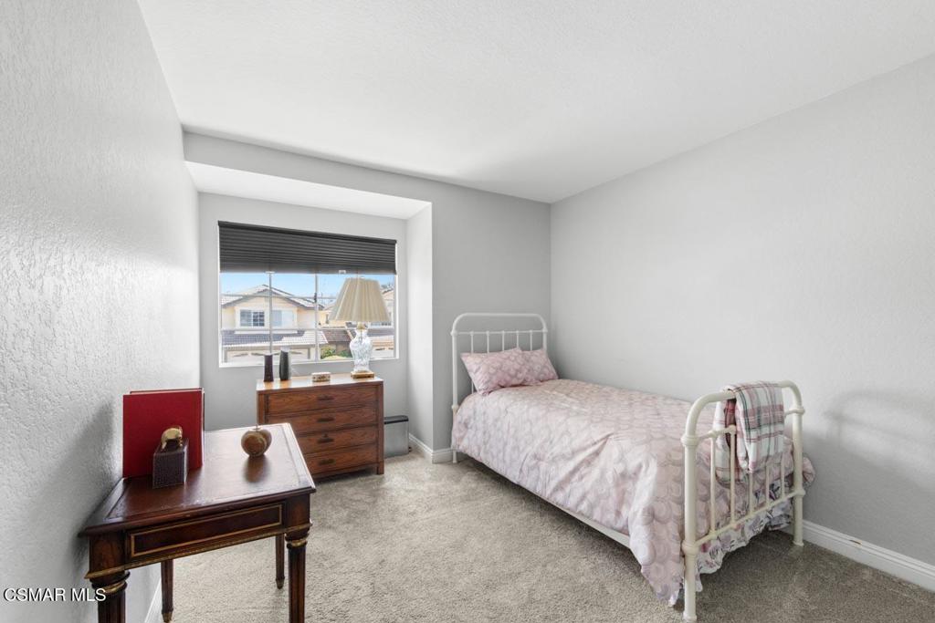 582 Fairfield Road Simi Valley, CA 93065 - Photo 16 of 31 a bedroom with a bed and a table