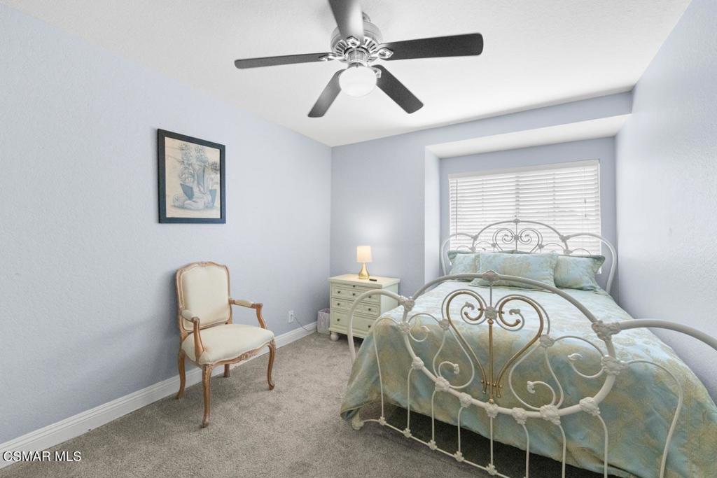 582 Fairfield Road Simi Valley, CA 93065 - Photo 18 of 31 a bedroom with a bed and a chair