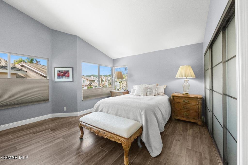 582 Fairfield Road Simi Valley, CA 93065 - Photo 21 of 31 a bedroom with a bed and wooden floor