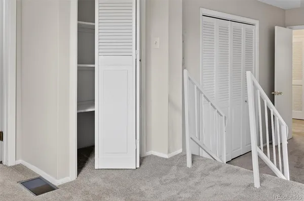 a view of a livingroom with stairs