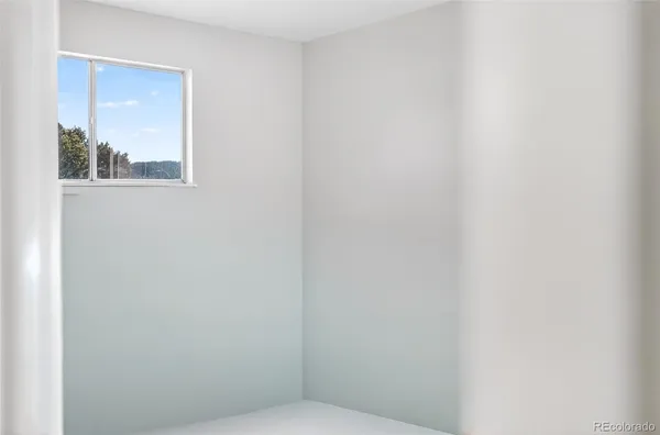 a view of a room that has a window in it
