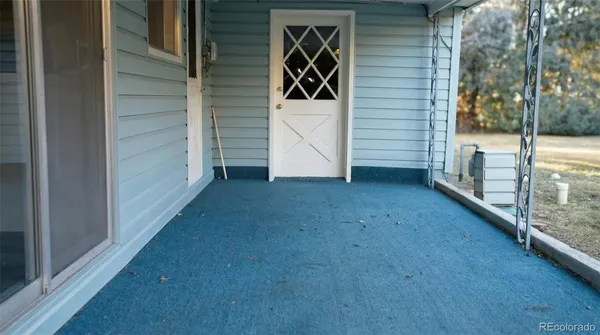 a view of empty room with fireplace