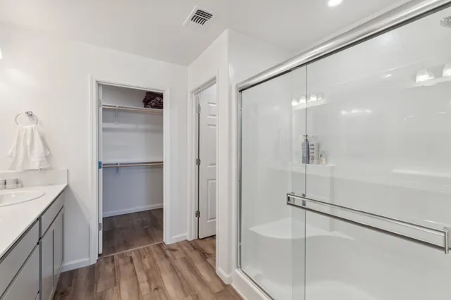 a bathroom with a sink and a shower