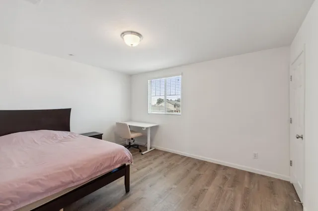 a bedroom with a bed and a table