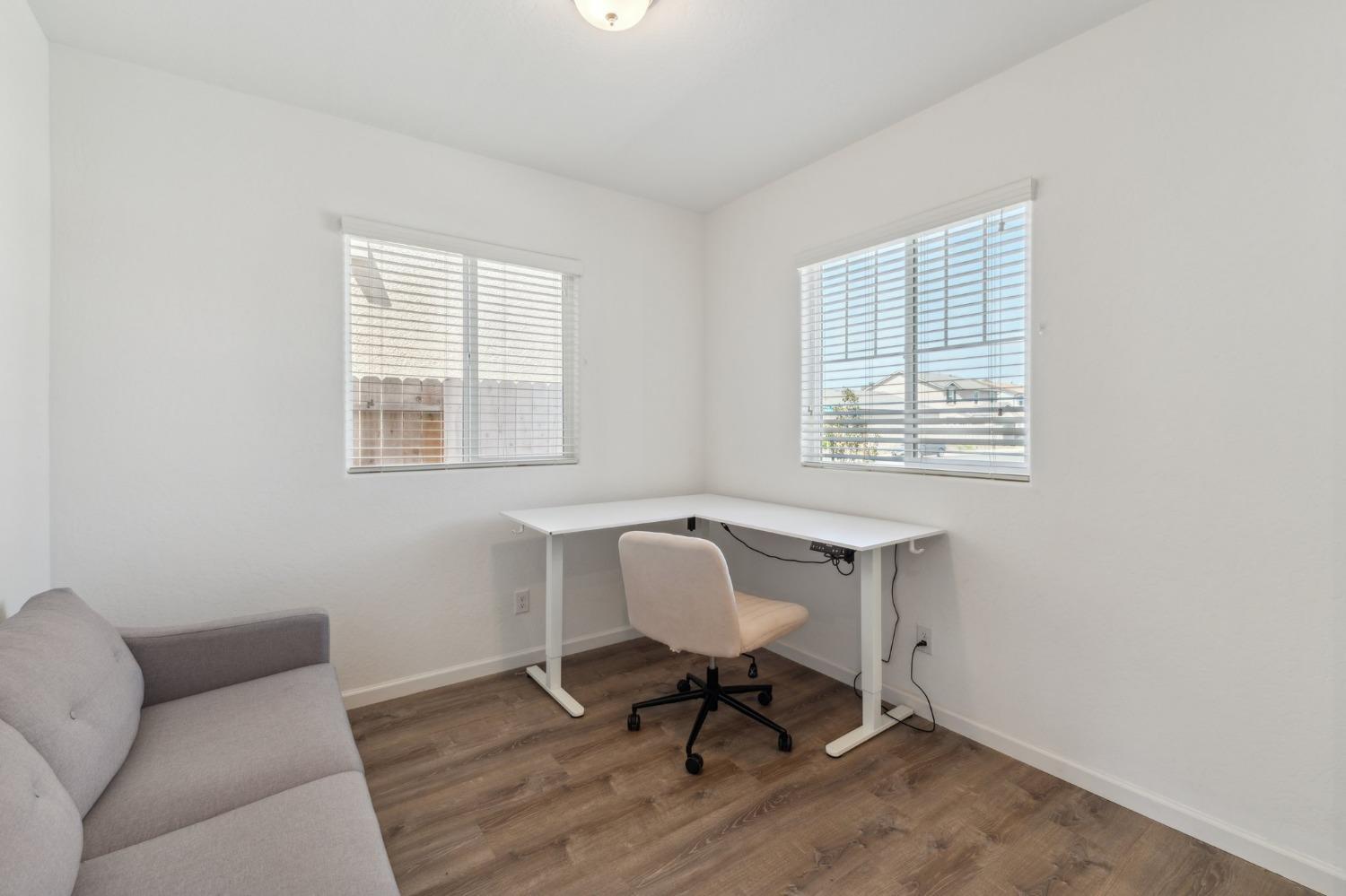 264 Rosebriar Street Madera, CA 93638 - Photo 19 of 28 a workspace with furniture and a window