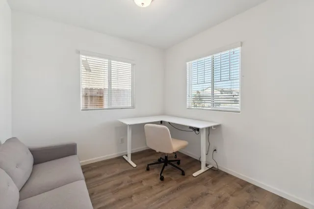 a workspace with furniture and a window