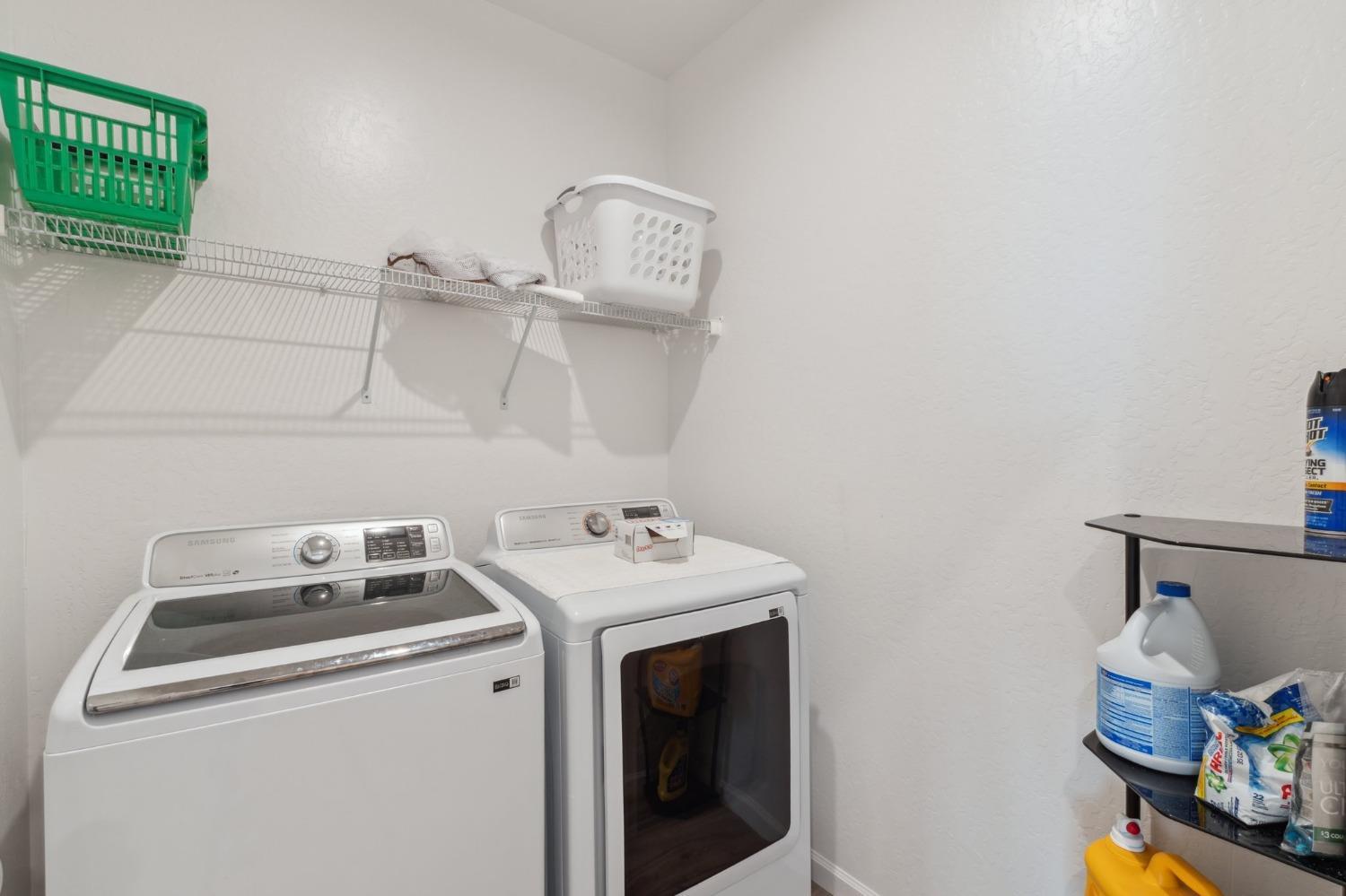 264 Rosebriar Street Madera, CA 93638 - Photo 22 of 28 a utility room with dryer and washer