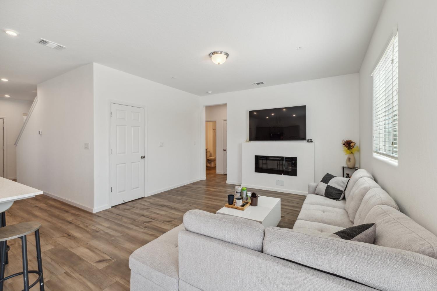 264 Rosebriar Street Madera, CA 93638 - Photo 7 of 28 a living room with furniture and a flat screen tv