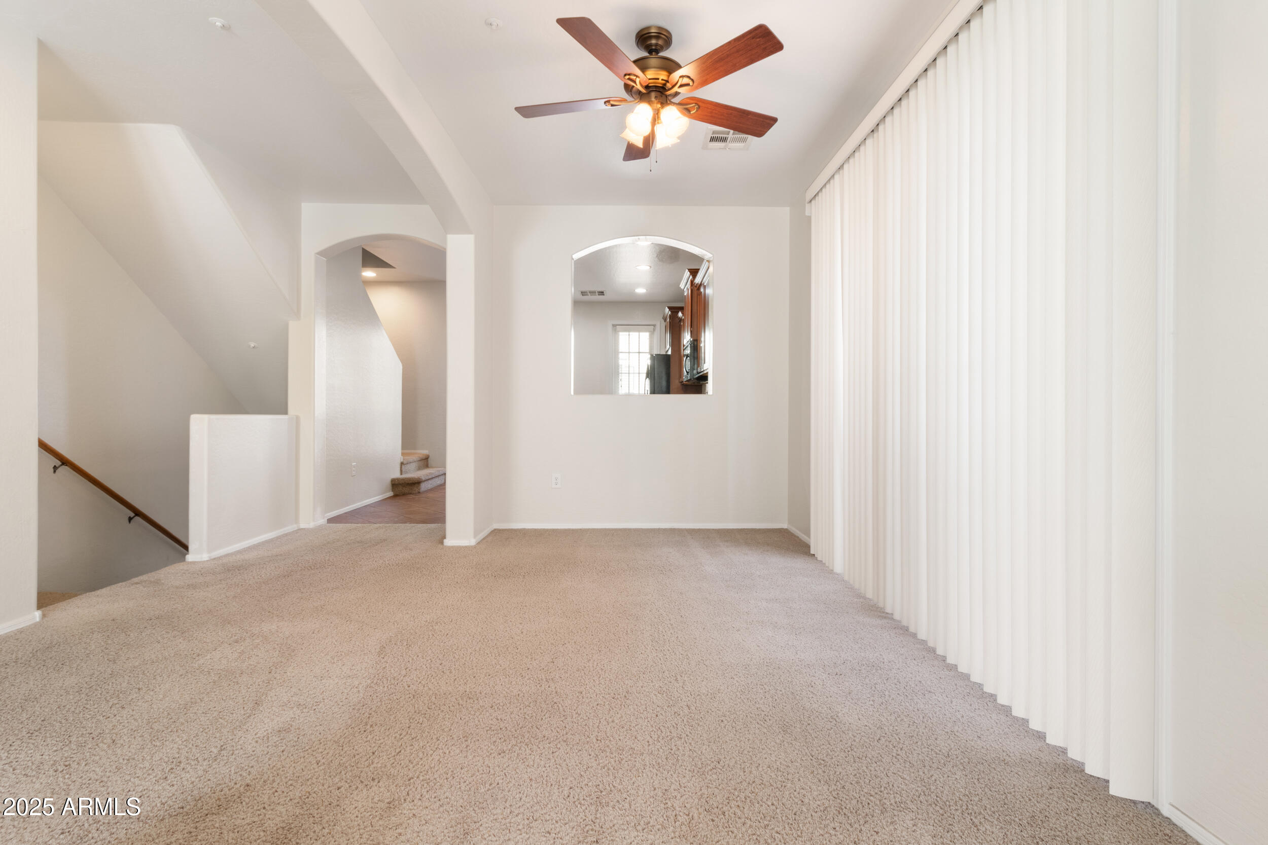 2789 South Key Biscayne Drive Gilbert, AZ 85295 - Photo 11 of 47 a view of a livingroom with a ceiling fan and window
