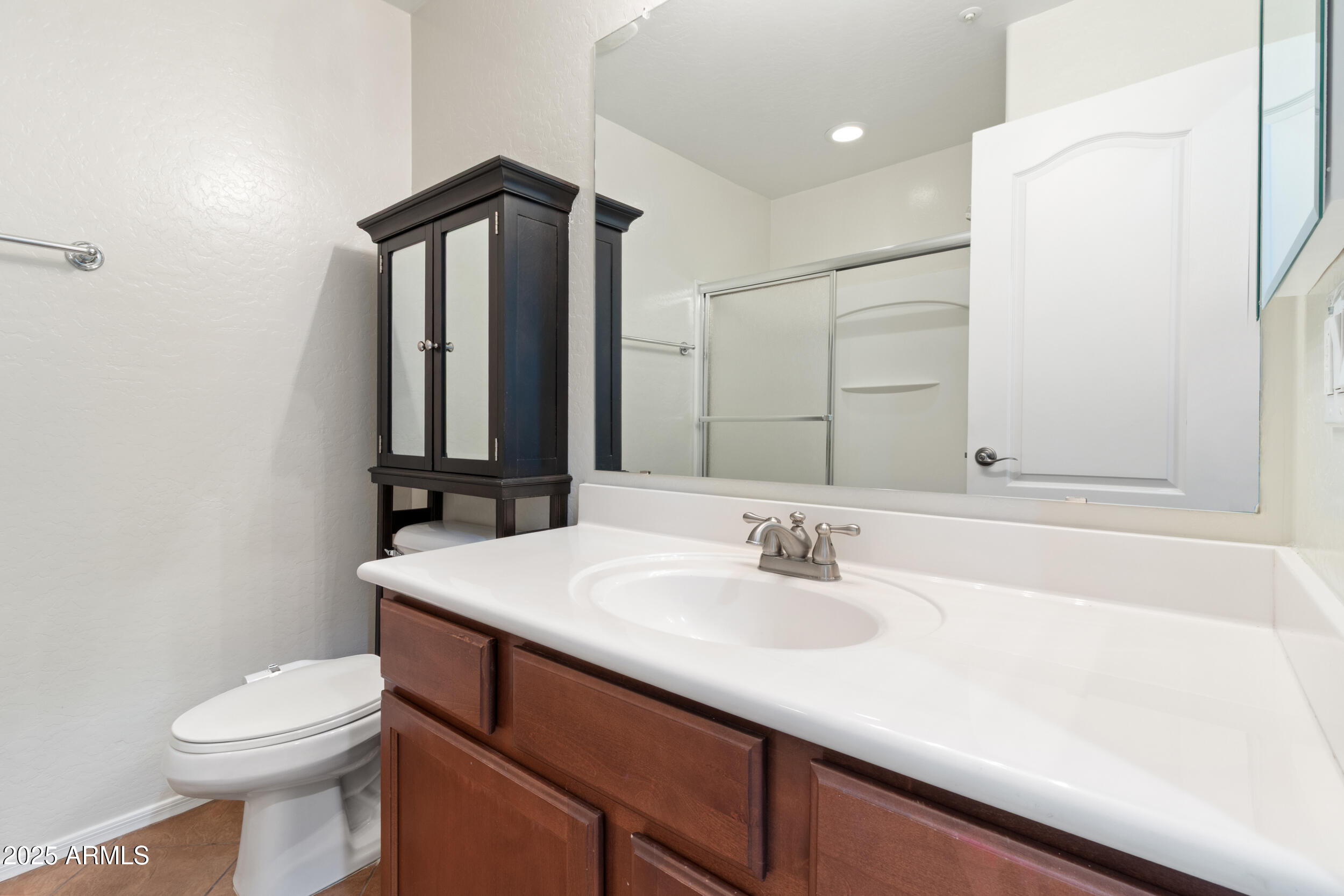 2789 South Key Biscayne Drive Gilbert, AZ 85295 - Photo 25 of 47 a bathroom with a sink a toilet and mirror