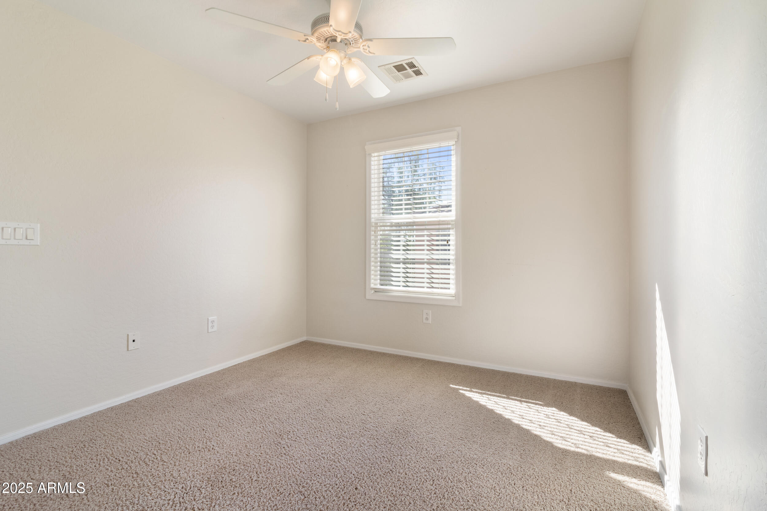 2789 South Key Biscayne Drive Gilbert, AZ 85295 - Photo 28 of 47 an empty room with a window and a fan