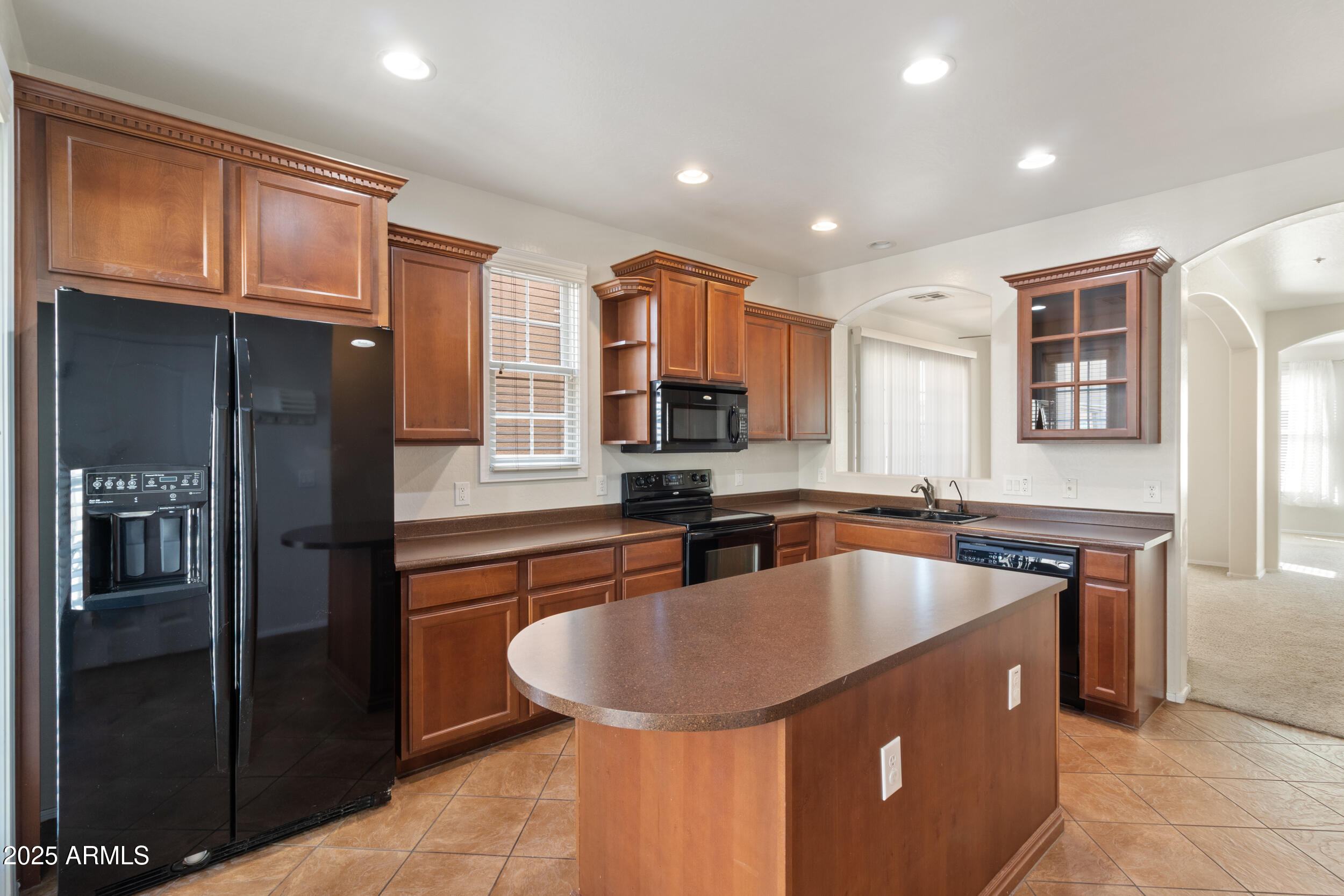 2789 South Key Biscayne Drive Gilbert, AZ 85295 - Photo 4 of 47 a kitchen with stainless steel appliances granite countertop a sink refrigerator and cabinets