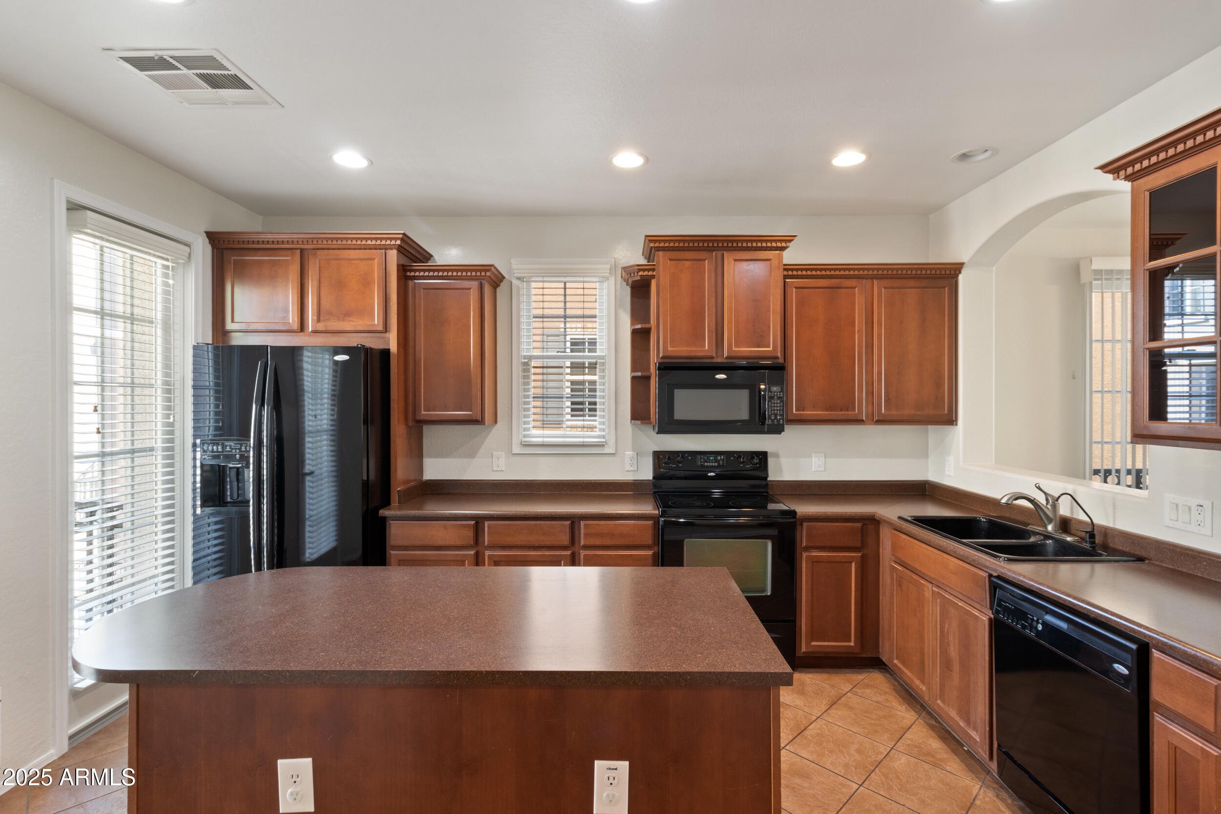 2789 South Key Biscayne Drive Gilbert, AZ 85295 - Photo 5 of 47 a kitchen with stainless steel appliances granite countertop a stove a sink dishwasher a refrigerator and cabinets with wooden floor