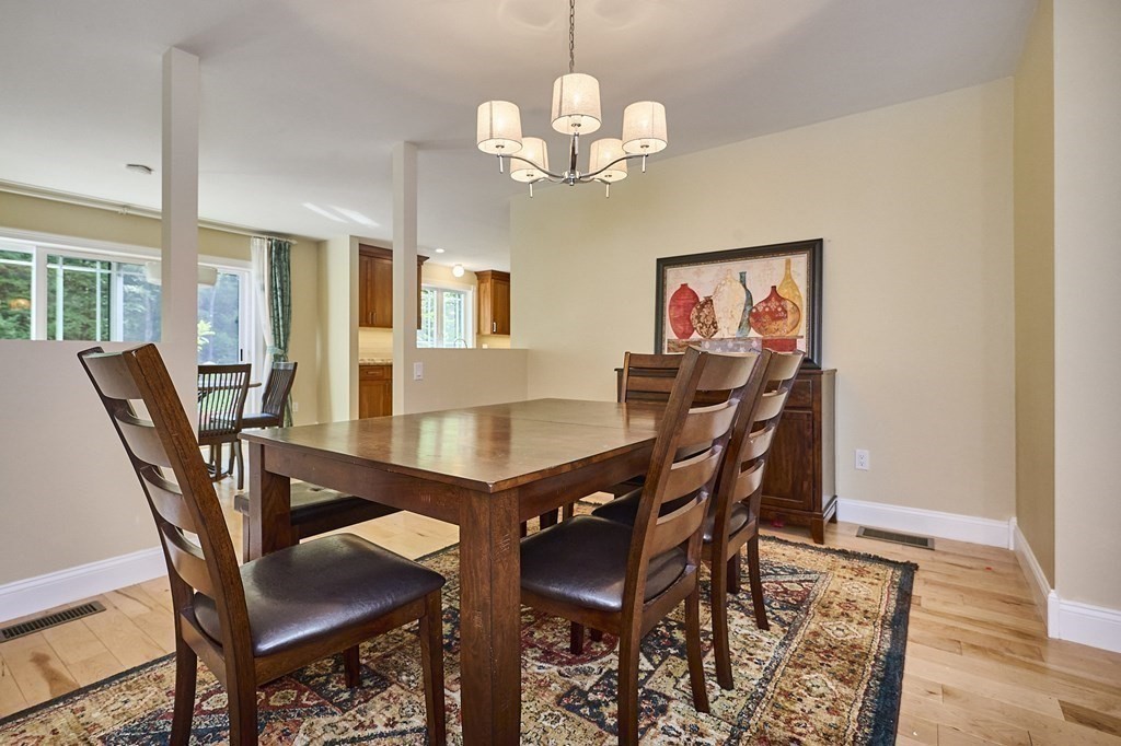 107 Concord Way Amherst, MA 01002 - Photo 11 of 41 a view of a dining room with furniture and wooden floor