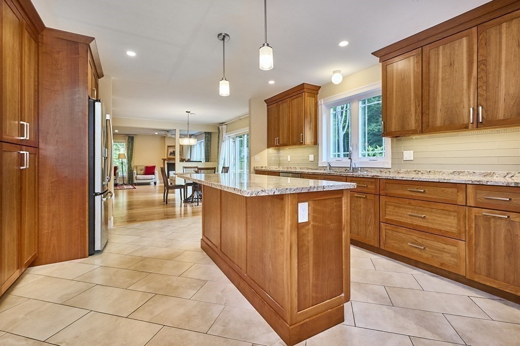 107 Concord Way Amherst, MA 01002 - Photo 13 of 41 a large kitchen with kitchen island lots of counter space a sink appliances and cabinets