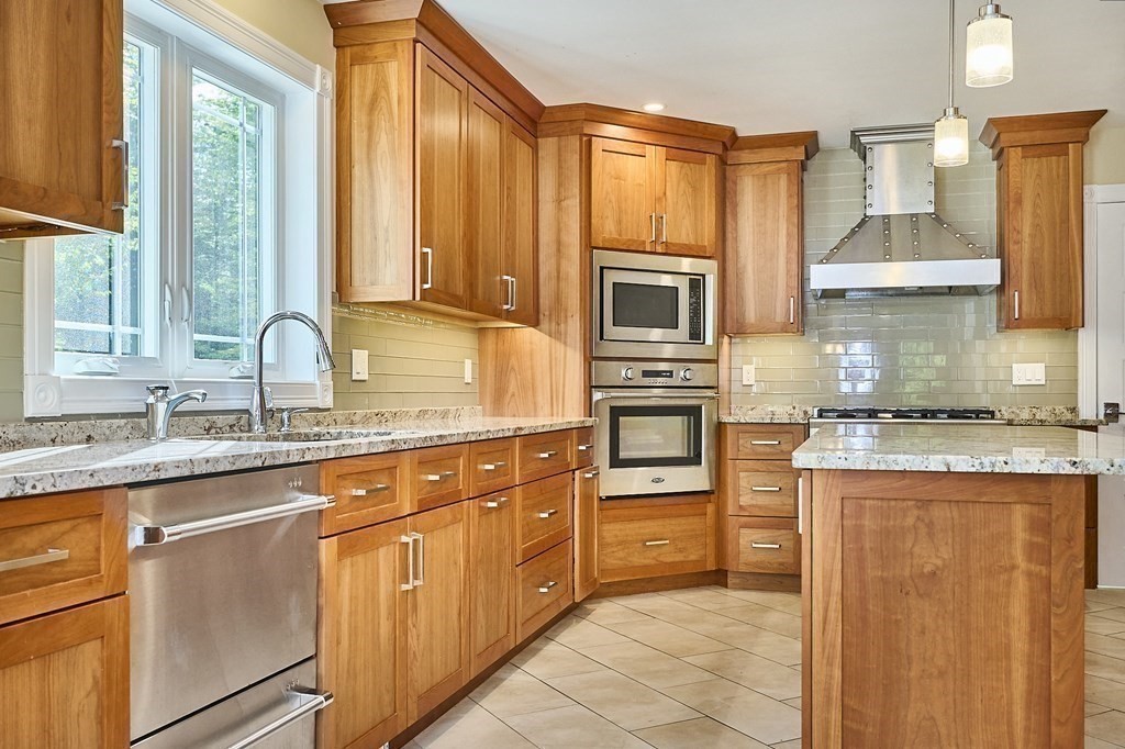 107 Concord Way Amherst, MA 01002 - Photo 14 of 41 a kitchen with stainless steel appliances granite countertop a stove a sink and a refrigerator