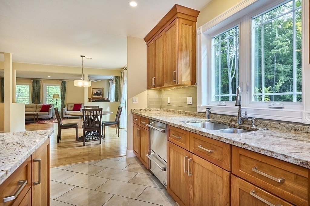 107 Concord Way Amherst, MA 01002 - Photo 15 of 41 a kitchen with stainless steel appliances granite countertop sink stove and refrigerator