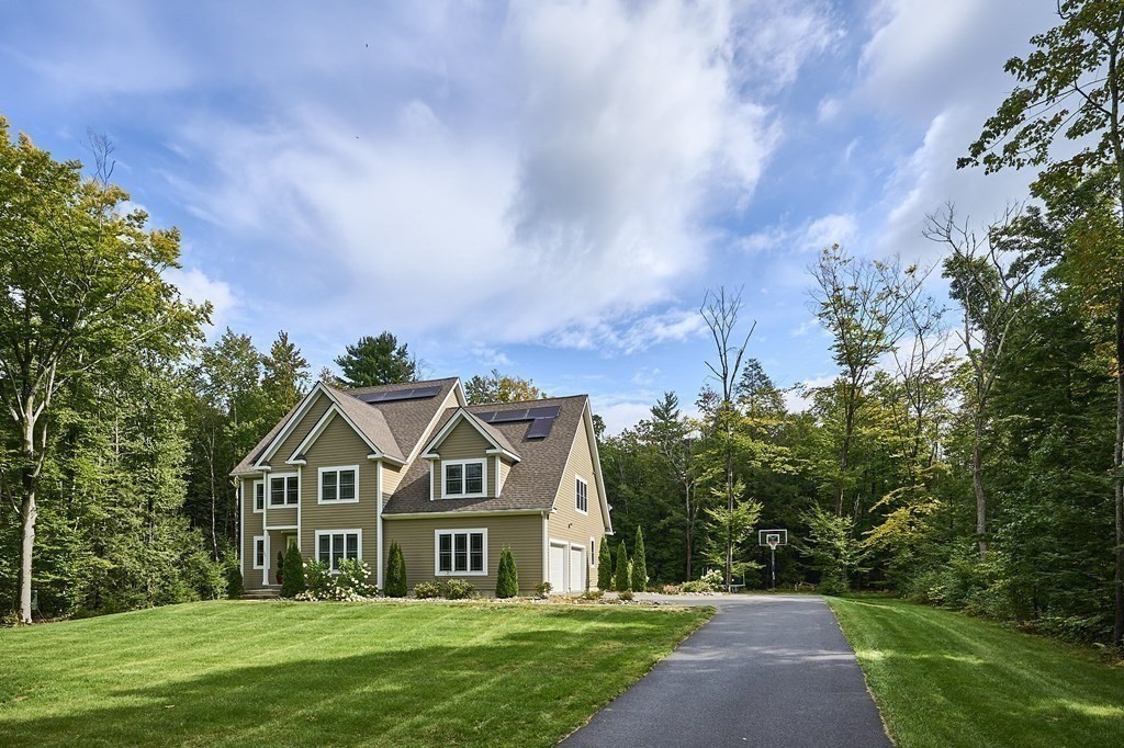 107 Concord Way Amherst, MA 01002 - Photo 2 of 41 a front view of a house with a yard