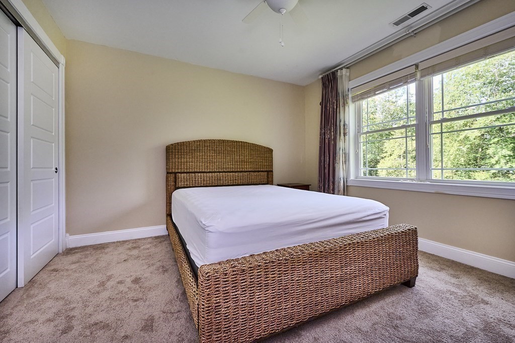 107 Concord Way Amherst, MA 01002 - Photo 23 of 41 a bedroom with a bed and window