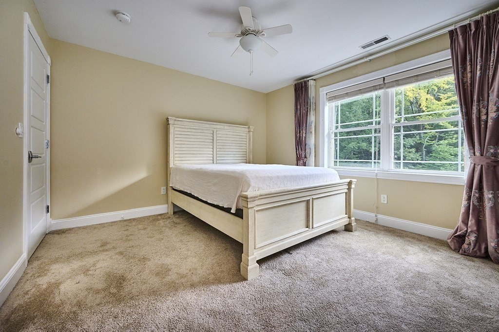 107 Concord Way Amherst, MA 01002 - Photo 24 of 41 a room with a bed and a window