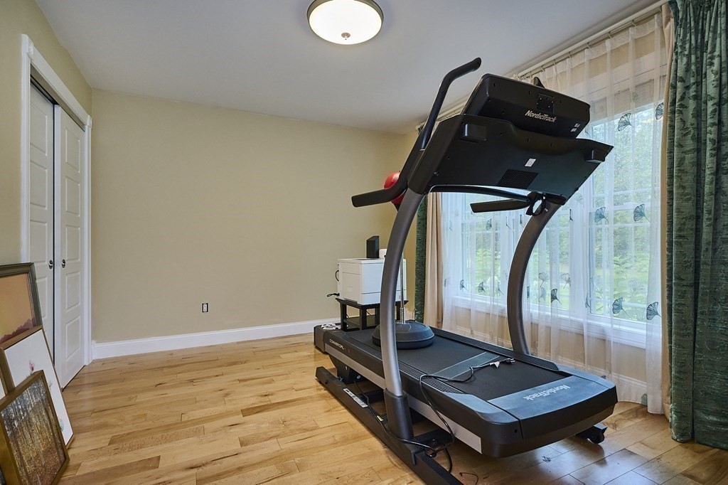 107 Concord Way Amherst, MA 01002 - Photo 25 of 41 a living room with a flat screen tv and a window