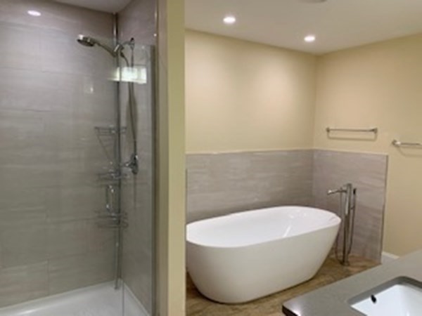 107 Concord Way Amherst, MA 01002 - Photo 26 of 41 a bathroom with a white bath tub and shower