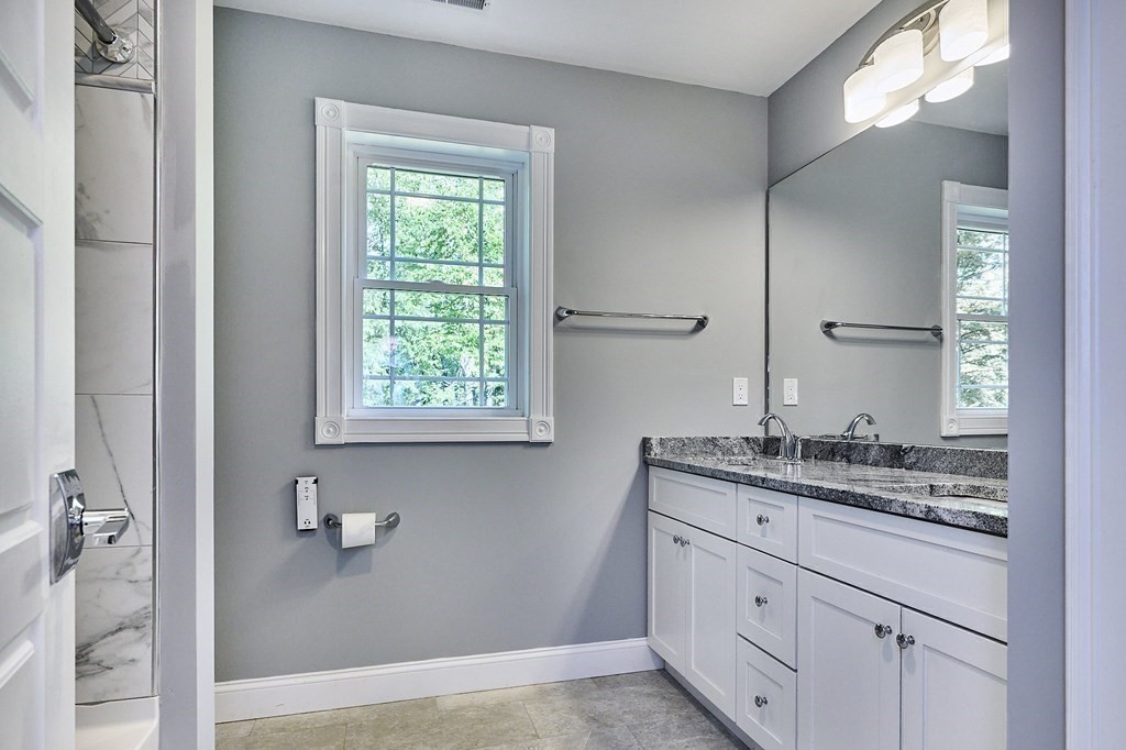 107 Concord Way Amherst, MA 01002 - Photo 30 of 41 a bathroom with a granite countertop sink mirror and window