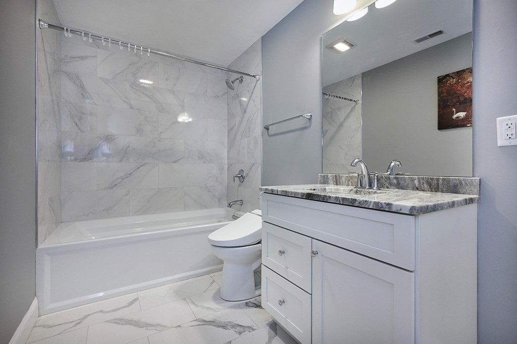 107 Concord Way Amherst, MA 01002 - Photo 31 of 41 a bathroom with a granite countertop sink toilet and shower